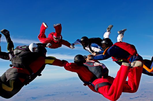 Skydiving teamwork formation make a circle